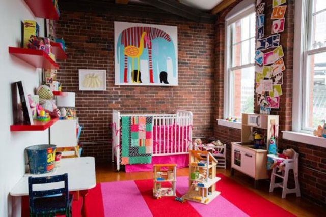 red brick walls look bright and blend perfecctly with this colorful nursery design