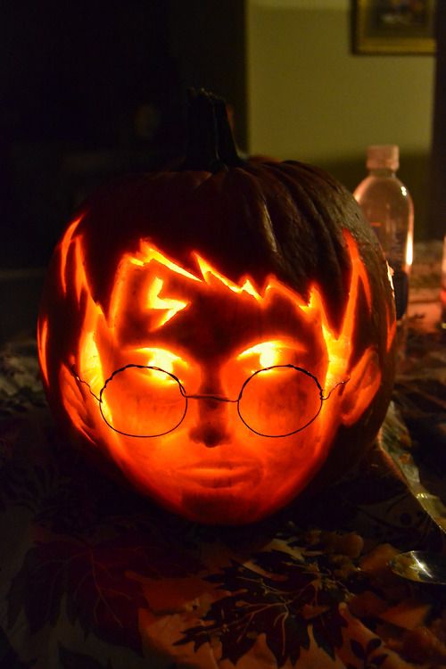 awesome carved Harry Potter pumpkin and lantern looks like a live head