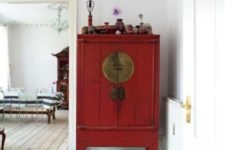 13 heirloom Asian antique cabinet blends in a whitewashed space