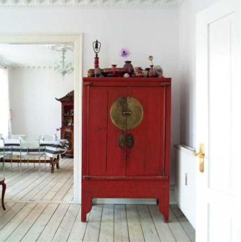 heirloom Asian antique cabinet blends in a whitewashed space