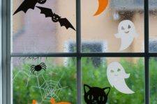 14 adorable Halloween window clings featuring happy pumpkins, laughing ghosts and pretty cats