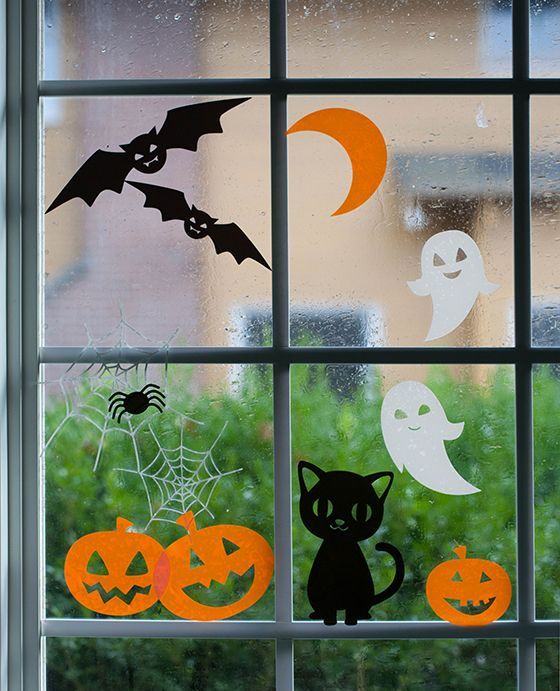 adorable Halloween window clings featuring happy pumpkins, laughing ghosts and pretty cats
