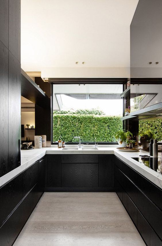 black wooden cabinets look great with white marble tops and make a perfect modern kitchen