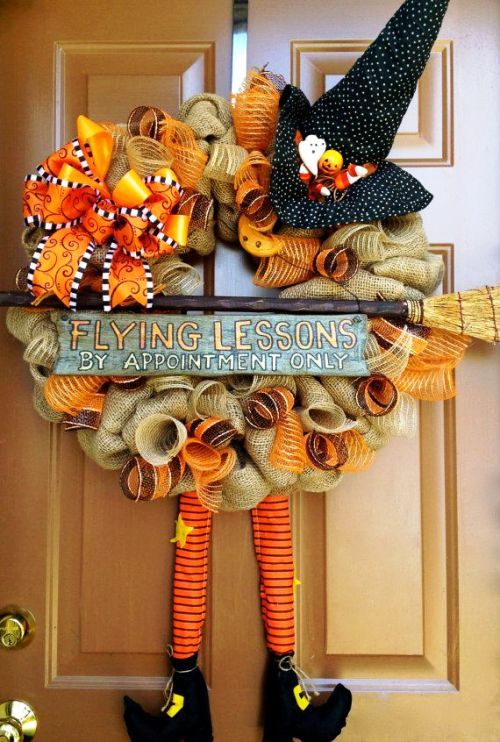 burlap Halloween wreath with a flying lessons announcement is a fun idea