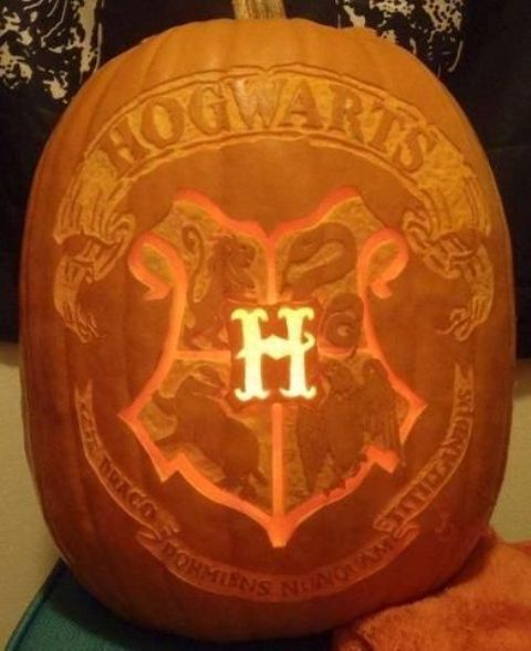 Hogwarts pumpkin carved and working as a lantern