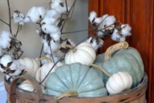 15 spray painted neutral pumpkins and cotton in a vintage wooden bucket