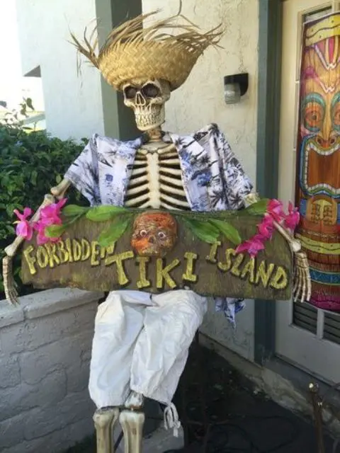 tropically dressed skeleton with a sign