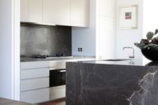 17 black soapstone spruces up this seemingly simple modern kitchen