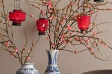 17 cherry-blossom branches with red paper lanterns