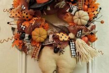 17 orange witch wreath with spiders, pumpkins and brooms