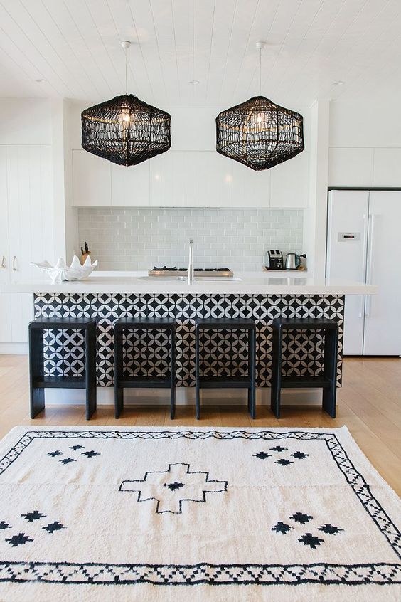Play with colors and textures like here   a patterned kitchen island and crochet lampshades