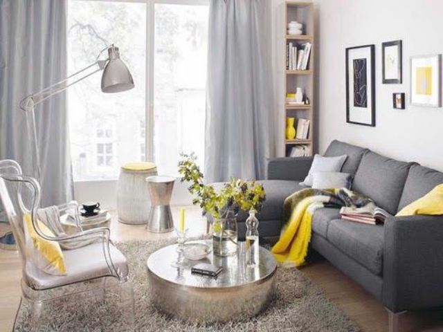 dark grey sofa, dove grey curtains, yellow textiles and a vase