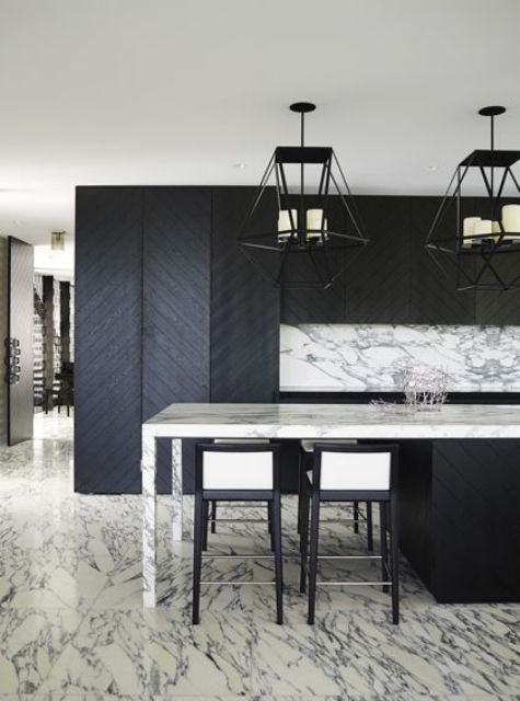 Marble and chevron clad wood make this kitchen eye catchy and interesting