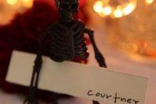 18 skeleton as a card holder is a simple and budget-friendly idea