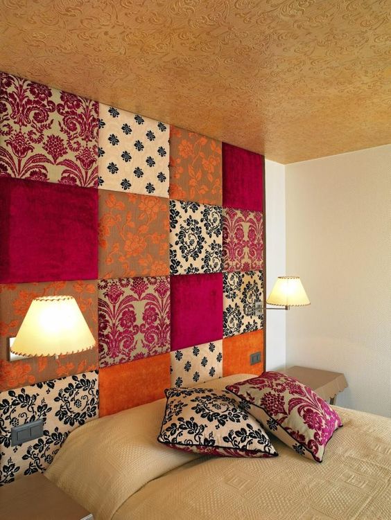 patchwork upholstered accent wall doubles as a headboard