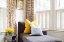 20 a charcoal couch and a bold yellow pillow look very contrasting