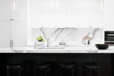 20 white marble benchtops and splashback, white shaker cabinets with minimal black handles, glass pendant lights with black cords