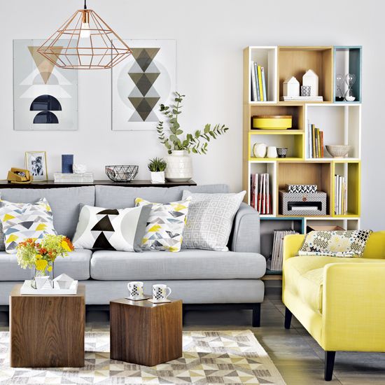 a light grey sofa with a bright yellow chair in the same style