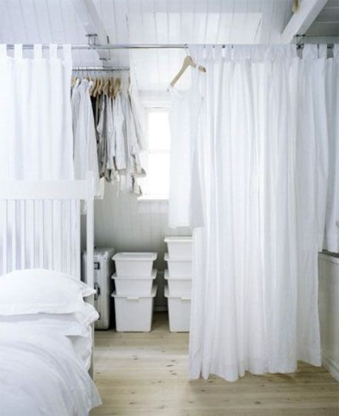 a sheer curtain may easily hide a closet space and make your sleeping zone more private