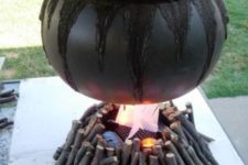 21 cauldron with sticks for outdoor Halloween decor