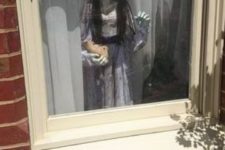 22 scary child standing by the window is a cool and frightening idea