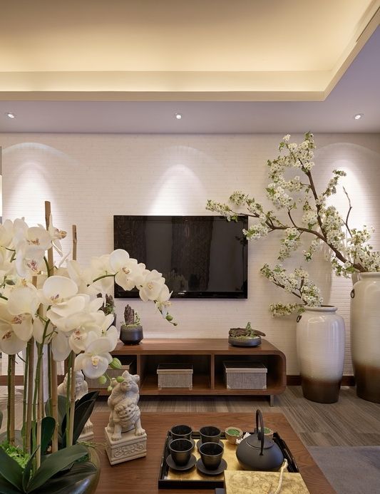 white orchids and white silk cherry blooms give a Chinese feel
