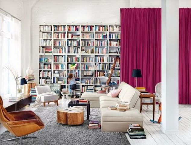 bold pink curtains that hide a whole library