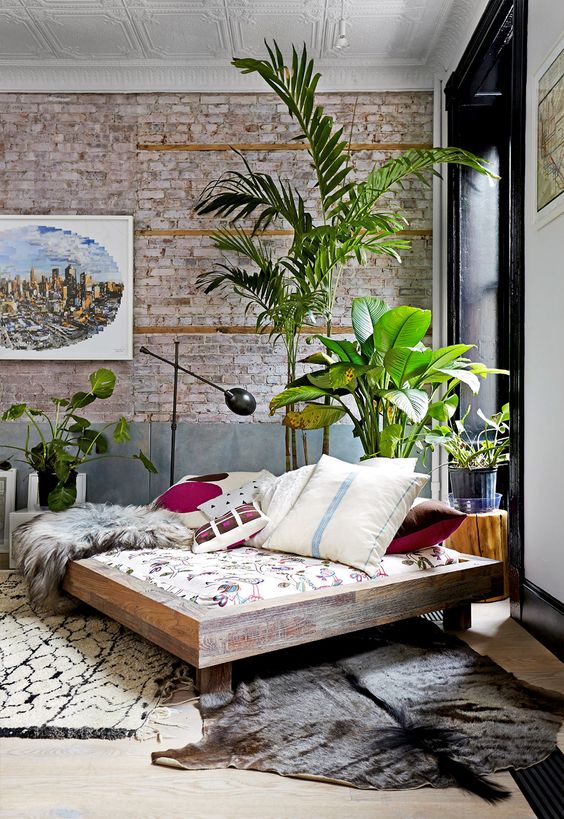 brick accent wall brings chic and texture to the room