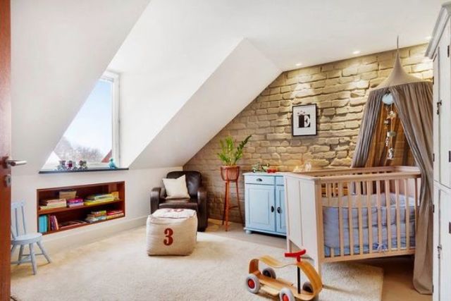 this neutral nursery is accentuated with exposed brick