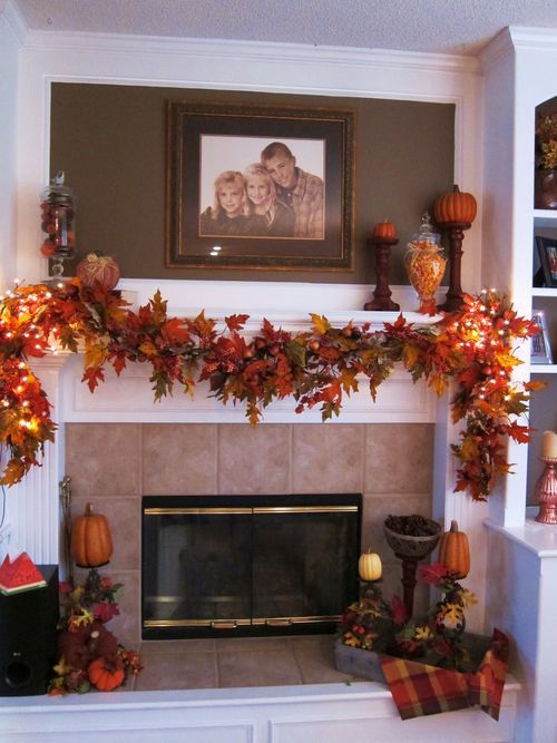 use a fall leaf garland to decorate your fireplace