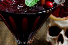 26 bloody zombie rum cocktail with a pirate-themed stirrer