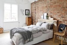 26 vitnage-inspired bedroom is accentuated with an exposed brick wall