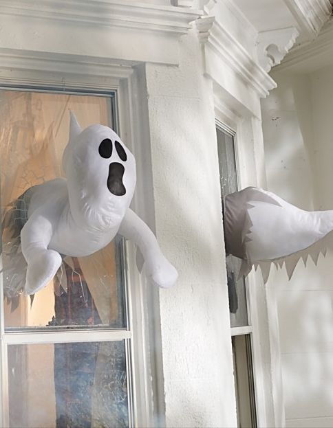 window crasher ghosts that appear inside and outside will give your window decor a new dimension