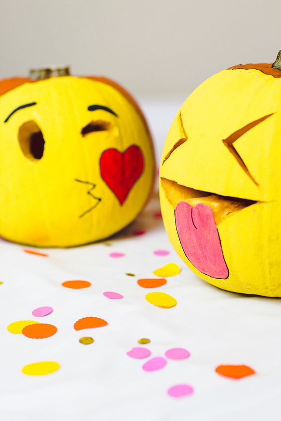 painted and carved emoji pumpkins