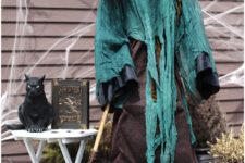28 scary faux witch with a black cat is a fantastic indoor and outdoor decoration to pop a Halloween party