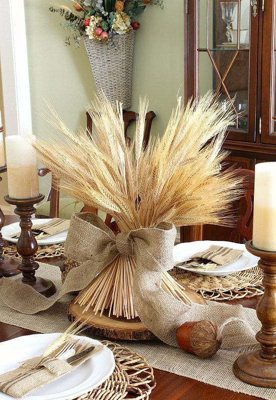 wheat with a burlap bow on a wooden slice is an ideal no fuss centerpiece