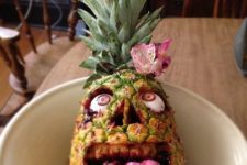 29 real pineapple, cherry Laffy Taffy tongue, black raspberry jam blood and custom undead eyes comprise a pineapple zombie face