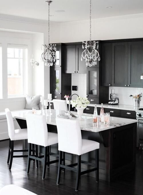 black kitchen cabinets with white countertops look perfect together