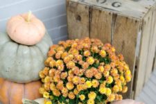 31 chalk painted pumpkins and orange flowers for a fall porch