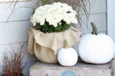 32 outdoor crate display with white pumpkins and potted flowers