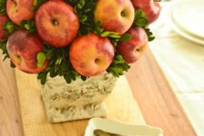 33 foam topiary form in a vase with sprigs of fresh greenery and apples