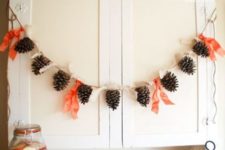 33 pinecones and fabric ties make up a cool fall garland