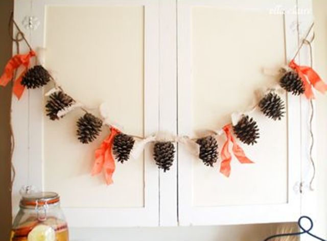 pinecones and fabric ties make up a cool fall garland