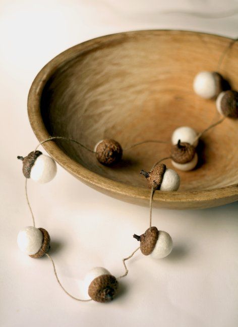 make acorns of felt and attach them to twine