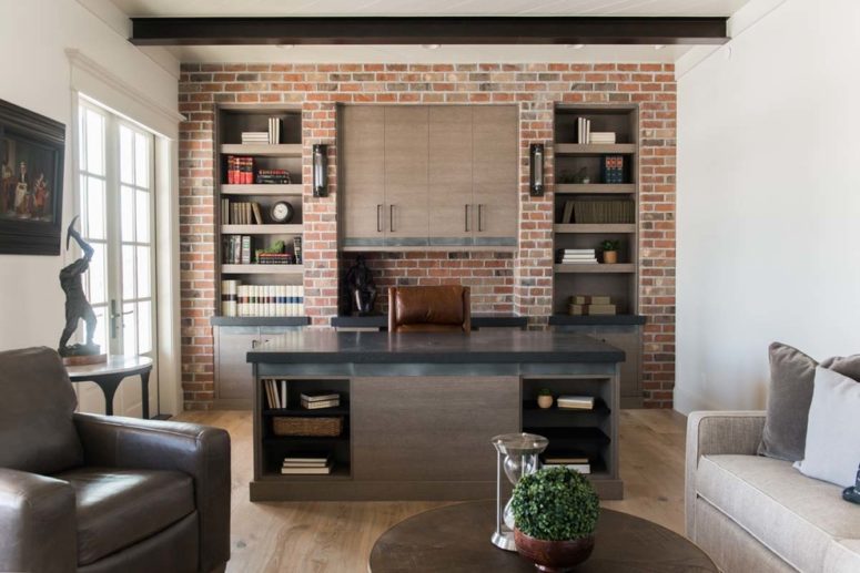 even faux brick wall makes a home office looks masculine (Remedy Furniture &amp; Design Center)