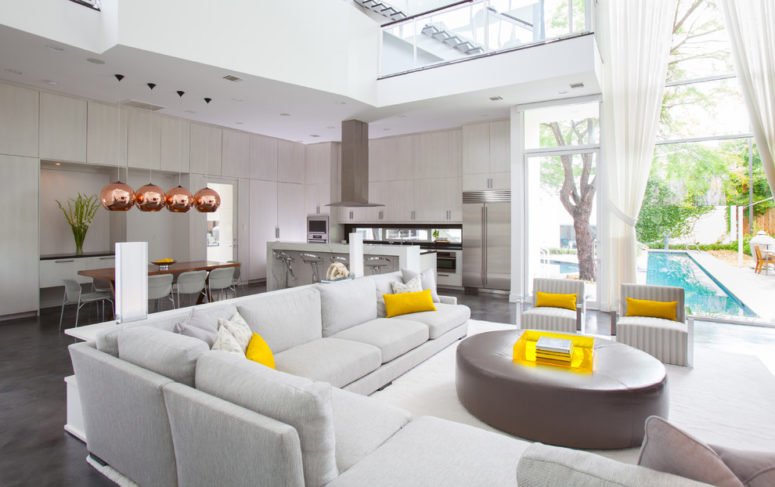 Pillows is the easiest way to add yellow touches to any interiors. (Laura U, Inc.)