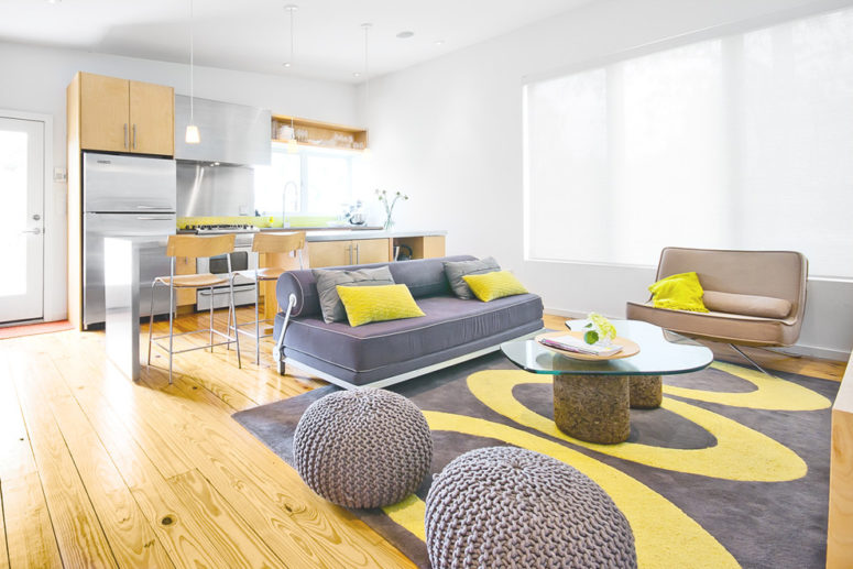 Natural wood works with a gray and yellow color combo quite well. (Intexure Architects)