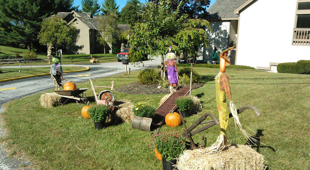 scarecrows doing your lawn is another cool and not traditional option for front yard halloween decor