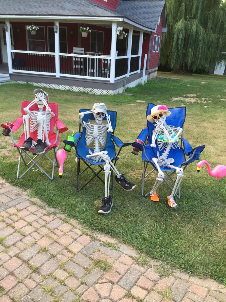 skeletons trying to get a sunburn is a cool idea for those who has lots of sunshine during this time of the year