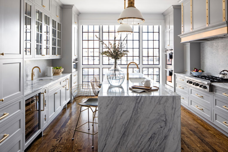 marble is a great choice for a waterfall countertop that helps to make a kitchen island looks like a work of art (Bria Hammel Interiors)